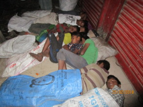 Children are sleeping on the verandah of stores