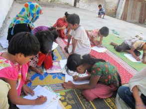Volunteer teacher Minoti helping the children
