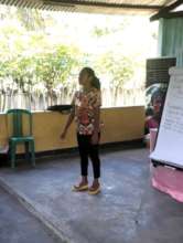 A deaf woman presents at a training on Atauro.