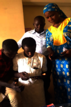 Almajiris using the Kindle for educational videos