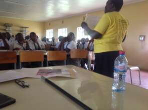 Gladys showing the students the effect of FGM