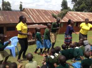 HFAW members, Geteni pupils and teacher dancing