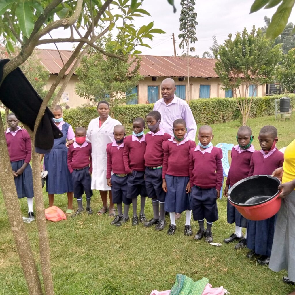 Students in new uniform, shoe and the headteacher