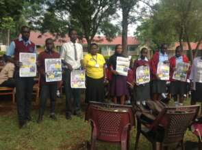 Learners showcasing FGM learning materials