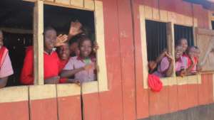 Excited students waving at the team