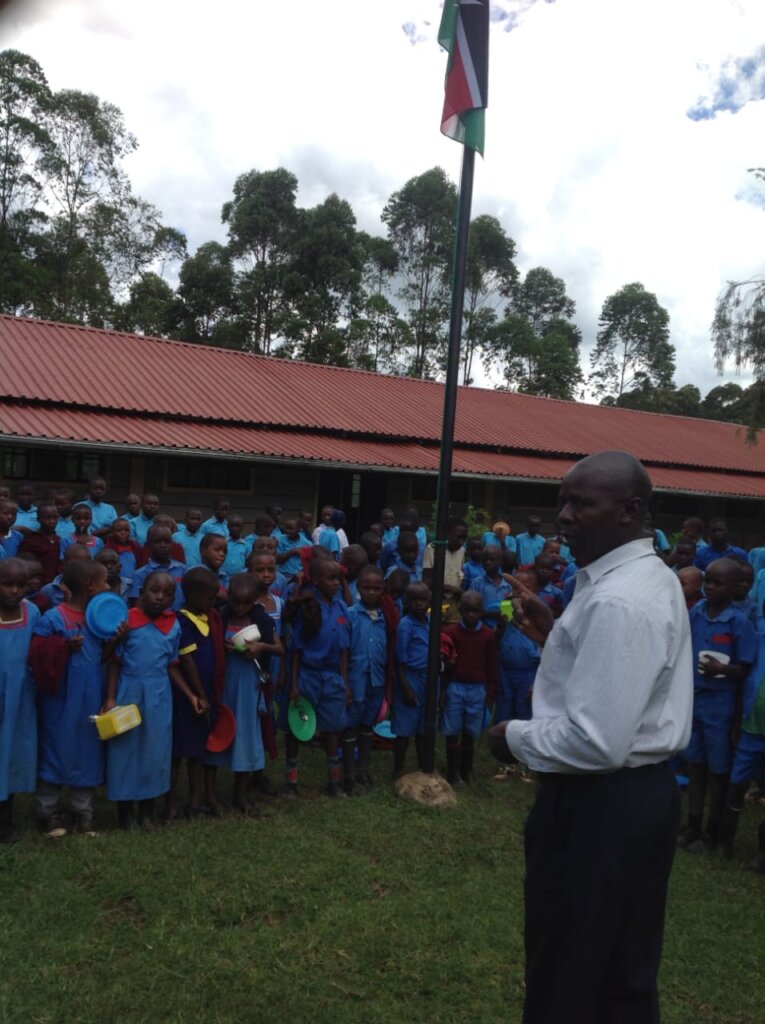 The teacher guiding learners on reporting abuse