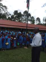 The teacher guiding learners on reporting abuse