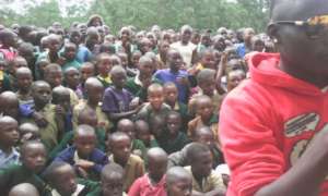 Crowd of pupils listening to anitFGM messaging