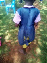 student wearing tattered uniform