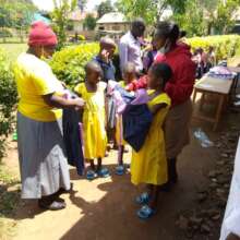 students receiving new uniform