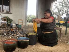 Felipa pulling out her yarns dyed with local plant