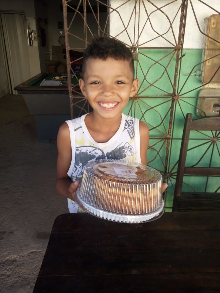 Happy recipient of one of Carlenia's cakes