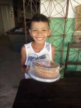 Happy recipient of one of Carlenia's cakes