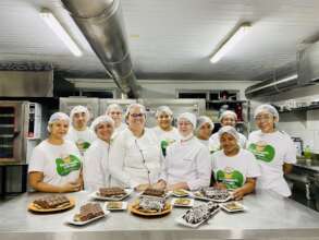 Students showing off chocolate treats they made