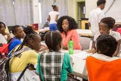 Cleo tutoring Barbudan children