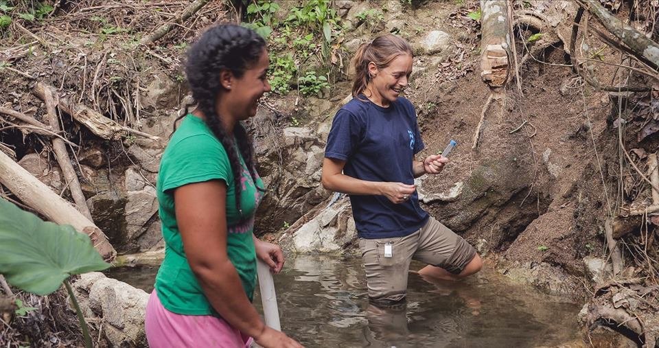 IsraAID water engineer checking the water source!
