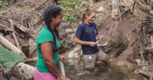 IsraAID water engineer checking the water source!