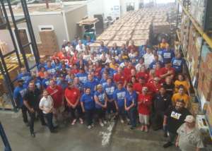Volunteer group coming in to assemble food boxes