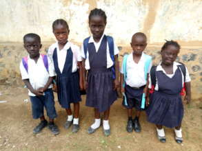 Several students with their new school supplies