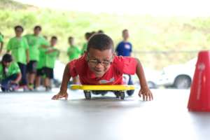 A young boy races during a team building activity