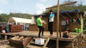 A volunteer dispatches food to community members