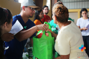 Volunteers dispatch food to community members