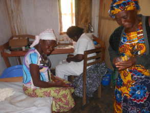 RECEADIT Tambi, Nurse consults Patient at Ngemsibo