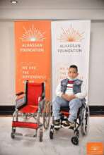 Abdul Rahman setting on his customized wheelchair