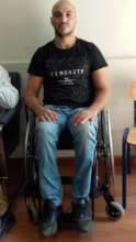 Alaa after getting his wheelchair