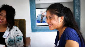 Sajju smiling as she takes part in the panel.