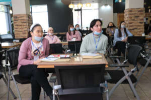 Taking in one of the conference sessions