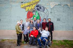 Mohammed and friends by his brand new mural