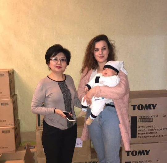 Ulianna presenting much needed supplies for kids