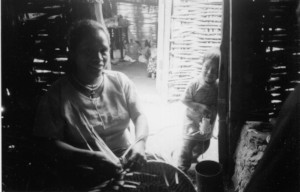 Lovely shot of Lucy weaving with one son watching