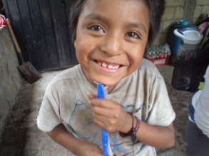 Young boy delighted with toothbrush gift.