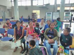 Mothers doing paperwork for their children's ID