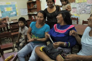 Mothers and young girls learning about condom use