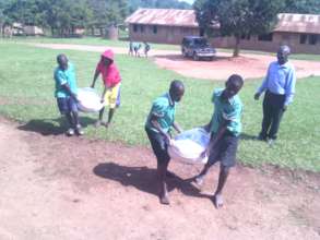 Pupils help to lift the flour