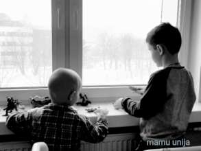 Little patient is playing with his big brother