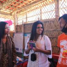 Shafin and Mariam with staff