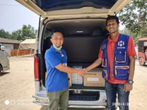Representative from MSF gifting the donations
