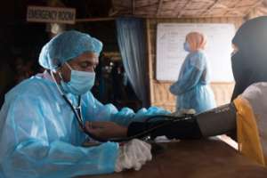 A doctor examines a patient
