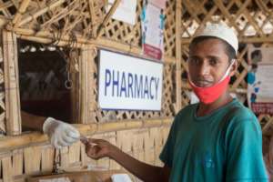 A patient getting medicines from the pharmacy