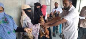 Women receiving poultry for income generation