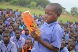 Primary student reads aloud on DEAR Day