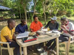 Elias in the middle, actively listening