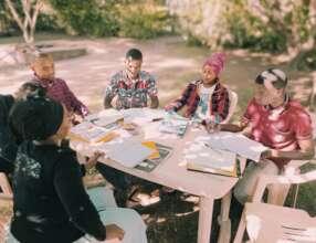 Group discussion outside Jifundishe Free Library