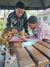 Mariam studying at Jifundishe