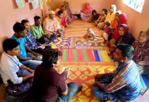 A listening group gathers to hear latest episodes