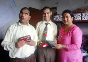 Boys receiving calculator and radio